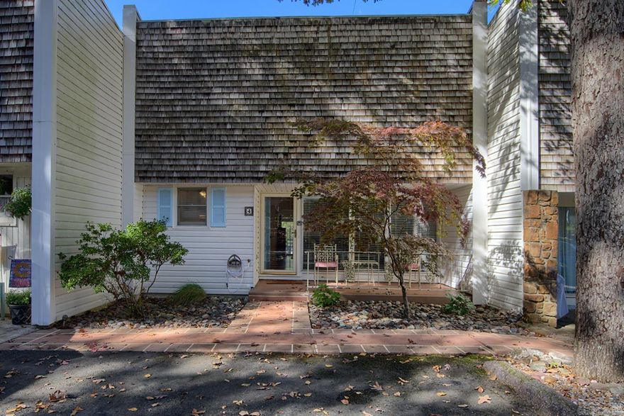 Charming two bedroom, two bath townhouse across from the deck and boat launch on Lake Desoto - a ski lake.  This adorable lakeside townhouse is updated from top to bottom, inside and out. This two bedroom, two bath unit has the master bedroom, living area, dining area and kitchen on the main floor with the second bedroom and a second, separate living area below. Boasting laminate and tile flooring, granite countertops, updated bathrooms, and it's own dock this townhome comes completely furnished for a turnkey option for a second home or a rental unit. Rental history is available.