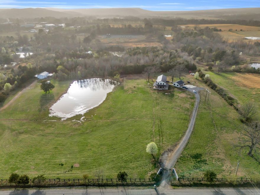 Your Dream Homestead Awaits! Welcome to this stunning and thoughtfully designed 2-story home, built in 2022 and perfectly situated on over 10 acres of peaceful countryside. With a spacious wrap-around porch, 2-car garage, and a long list of incredible features, this property truly has it all! Inside you'll find 4 bedrooms, 2.5 bathrooms, and an open-concept living space that's made for entertaining. The gourmet kitchen includes a walk-in pantry, high-end appliances, quartz-countertops, and custom cabinetry, while the oversized laundry room offer not one, but two washer/dryer sets. There's even a dedicated mud room and dog washroom to keep things clean and organized! Upstairs, the luxurious primary suite is a true retreat, featuring his and her vanities and closets, a soaking tub, and a cozy gas fireplace right in the bedroom. Step outside and you'll find a large, stocked pond, 30x40 shop, storm cellar, RV hook-ups, and over 25 fruit trees. This property is outside of city limits, so bring your cows, horses, and chickens - the possibilities are endless! Very close to public River access. 15-20 minutes to either Searcy or Heber Springs. Schedule your tour today!