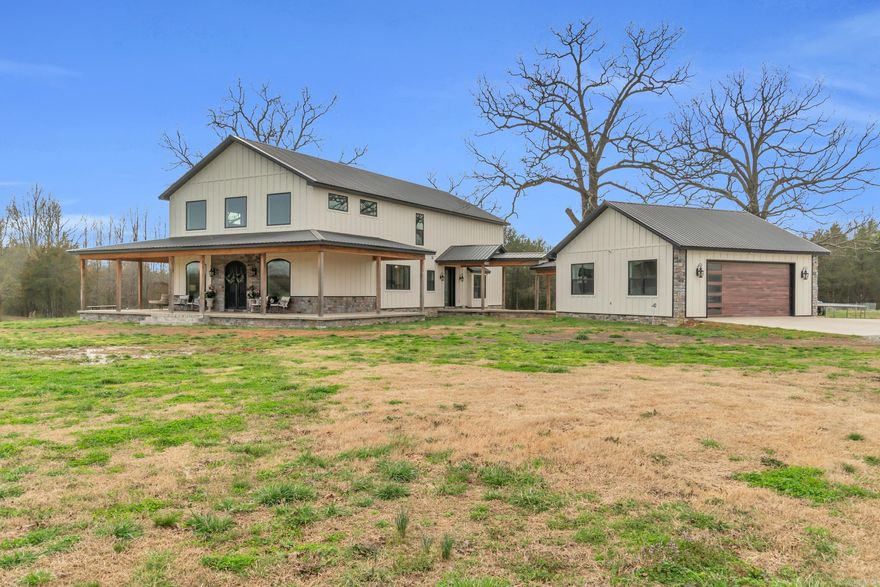 Your Dream Homestead Awaits! Welcome to this stunning and thoughtfully designed 2-story home, built in 2022 and perfectly situated on over 10 acres of peaceful countryside. With a spacious wrap-around porch, 2-car garage, and a long list of incredible features, this property truly has it all! Inside you'll find 4 bedrooms, 2.5 bathrooms, and an open-concept living space that's made for entertaining. The gourmet kitchen includes a walk-in pantry, high-end appliances, quartz-countertops, and custom cabinetry, while the oversized laundry room offer not one, but two washer/dryer sets. There's even a dedicated mud room and dog washroom to keep things clean and organized! Upstairs, the luxurious primary suite is a true retreat, featuring his and her vanities and closets, a soaking tub, and a cozy gas fireplace right in the bedroom. Step outside and you'll find a large, stocked pond, 30x40 shop, storm cellar, RV hook-ups, and over 25 fruit trees. This property is outside of city limits, so bring your cows, horses, and chickens - the possibilities are endless! Very close to public River access. 15-20 minutes to either Searcy or Heber Springs. Schedule your tour today!