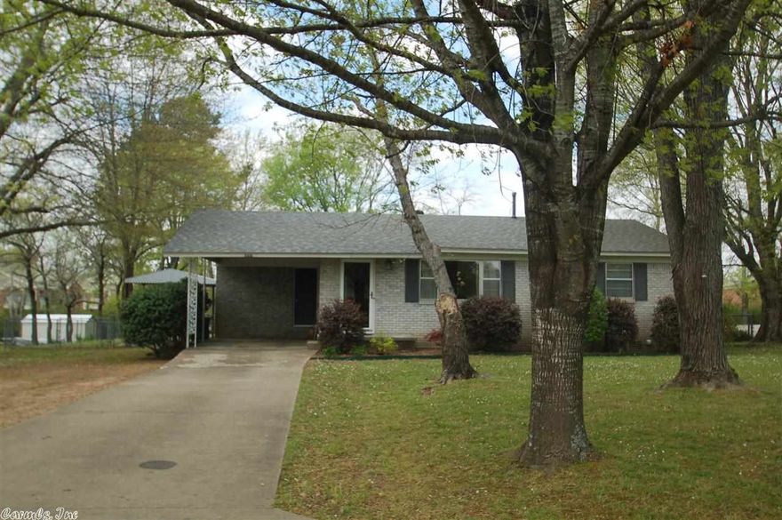 An absolute immaculate dollhouse!  All brick with single carport.  Open living, dining and kitchen, 2 bedrooms plus bath.  Covered patio on the back.  Double gate to backyard