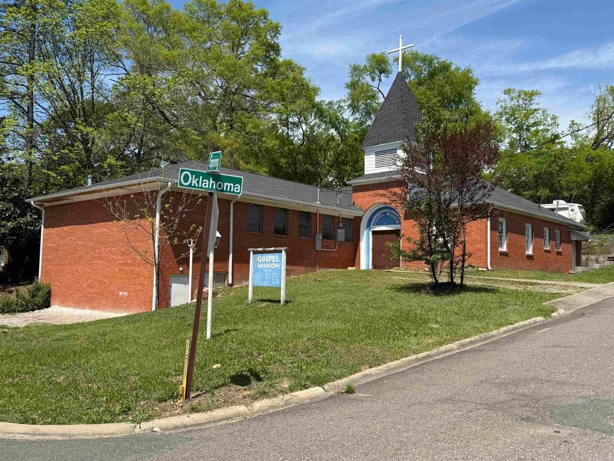 Versatile brick building with excellent road frontage and visibility, most recently used as a church. The main level is approx. 3,428 sf and features a spacious 2100+ sf sanctuary with stage, a dedicated sound room, large kitchen, dining area, 3 private offices, 2 classrooms, a nursery and 2 restrooms. Basement offers approx. 400 sf with interior and exterior access-ideal for storage or future updates. Parking for 10-15 vehicles with additional side access. Conveniently located near the HS Convention Center and Hwy 70. Zoned CN (Civic Neighborhood zoning district), designed for a mix of civic, residential, and limited commercial uses. Being sold with furniture and equipment-turnkey opportunity. Schedule your showing today and start envisioning the possibilities! See video walk through to view interior. Camper is excluded from sale and will be removed before closing.