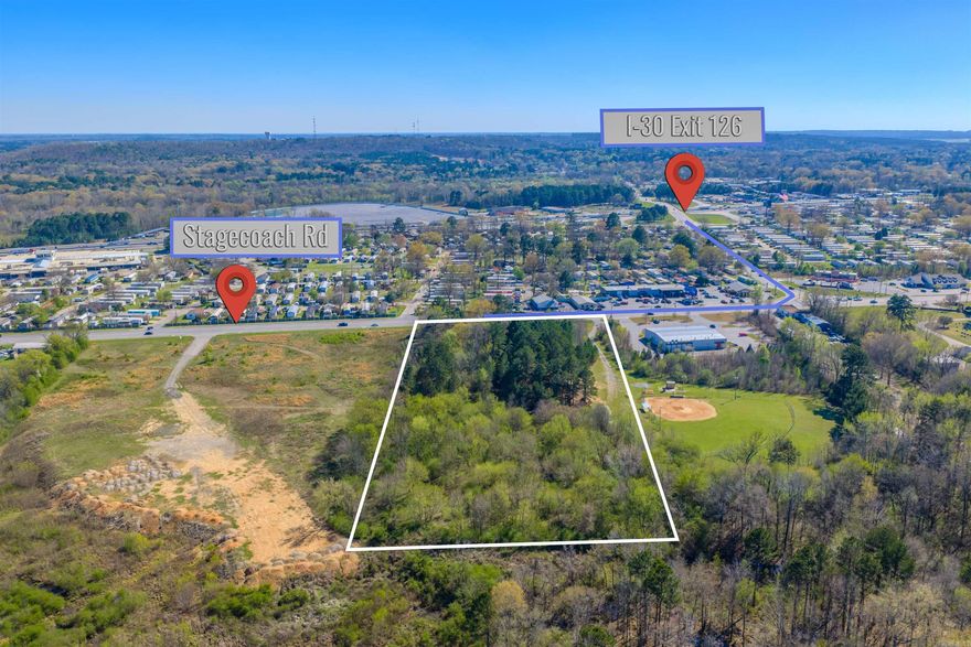 Strategically located at the Pulaski/Saline County line; this 7.67 +/- acre property offers a rare blend of commercial and residential potential just off Exit 126. With excellent accessibility and visibility near a major highway corridor, the front portion of the property is well-suited for commercial development, while the rear provides opportunities for residential use or future expansion.  This versatile tract is ideal for investors, developers, or business owners seeking a high-growth location with flexible zoning possibilities. Positioned in a developing area, the property benefits from strong traffic flow, convenient access to nearby cities, and increasing demand for both commercial services and residential housing.  Whether you’re looking to build, expand, or invest, this property offers outstanding potential in a prime, high-traffic location.  SEE VIDEO: https://www.dropbox.com/scl/fi/th4wchu8nuhcxg5p4od72/Video-Mar-16-2026-9-58-14-AM.mp4?rlkey=j0kco9g1jsk4kbvp8znn2op8d&st=zdxy3ti3&dl=0