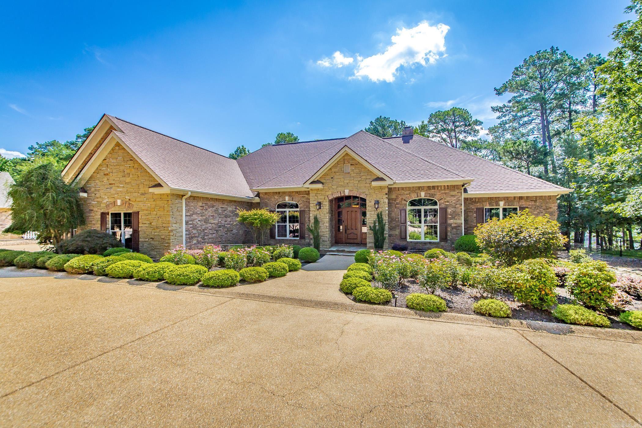 Experience the pinnacle of lakefront luxury in this masterfully crafted home, designed with meticulous attention to every detail. Enjoy the ultimate waterfront lifestyle, a deeded boat slip in Grand Isle Dockāfeaturing a new lift for your convenience is also available for purchase. Custom alder wood cabinetry graces the kitchen & bathrooms. Imported Brazilian interior doors & a striking custom-built mahogany front entrance welcome you in style. Two primary suites offer privacy & comfort, while a bonus room upstairs serves perfectly as a den, home theater, or bedroom. The existing half-bath can be easily expanded to a full bath. Enjoy high-end appliances, including a built-in Miele coffee machine. The walk-in wine cellar is temperature controlledāa Wine Connoisseur's dream. Every interior wall is insulated for superior quiet & energy efficiency, 2 lifetime warranty water heaters ensure a worry-free experience. Oversized two-car garage plus a separate attached garage/workshop. Enjoy comfort & efficiency w/ the brand new dual zone geothermal HVAC unit. New high-end composite decking & railing. Could be sold furnished. See Agent remarks. Relax & entertain overlooking Greers Ferry Lake.