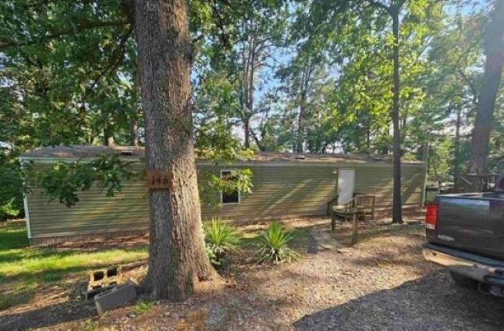 Looking for some peace and quiet to enjoy nature? Welcome to this nice 2 bedrooms, 2 baths, single wide mobile home situated on almost .65 acres of serene, wood lot. With 840 sq. ft of living space this split-open floorplan allows functionality & privacy of primary bedroom away from secondary bedroom. Out back you'll find the beauty of nature all around to enjoy! Price to sell!!
