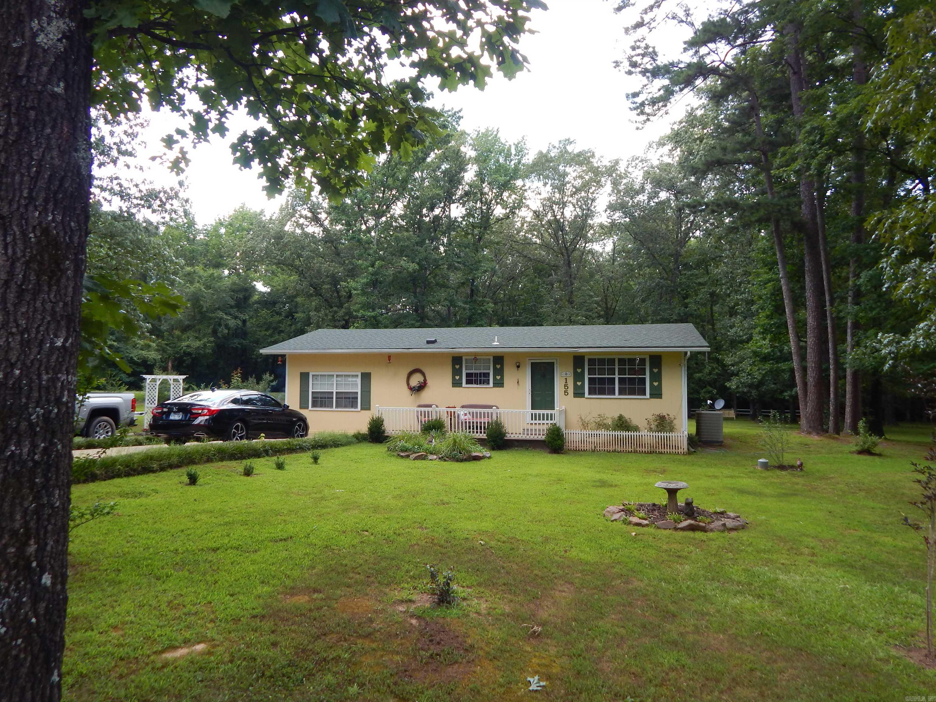 This cute home sets on 1.40 quiet peaceful acres. Beautiful, landscaped yard, garden spot, nice patio to enjoy the outside and grill. Well maintain. 2 living areas. This is a must see. Not far from Heber or Searcy. Close to the Little Red River.