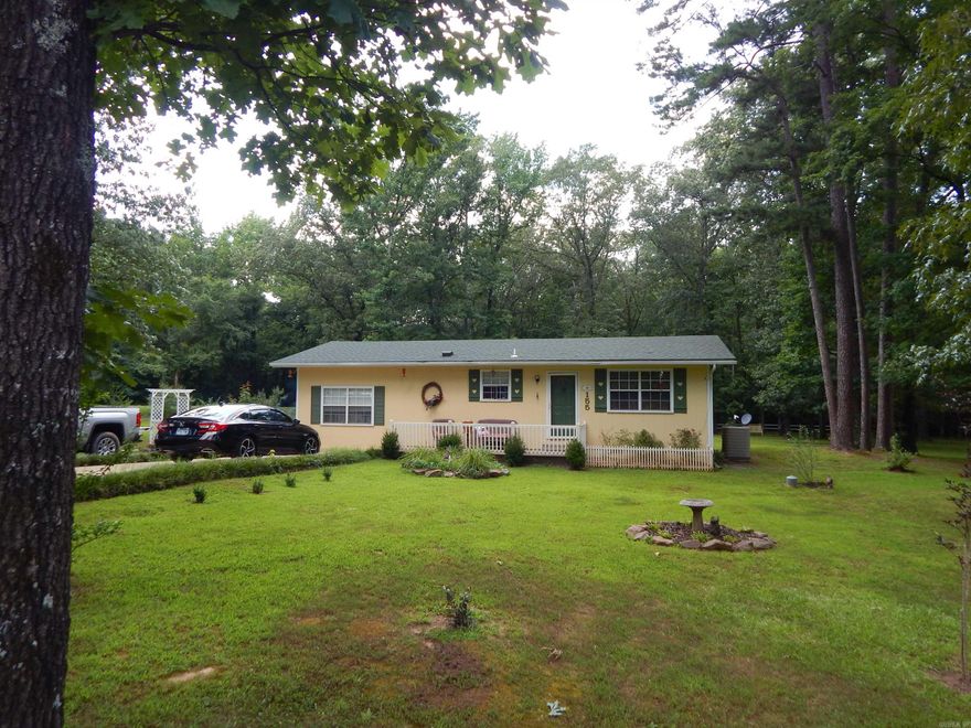 This cute home sets on 1.40 quiet peaceful acres. Beautiful, landscaped yard, garden spot, nice patio to enjoy the outside and grill.  Well maintain. 2 living areas. This is a must see.  Not far from Heber or Searcy.  Close to the Little Red River.