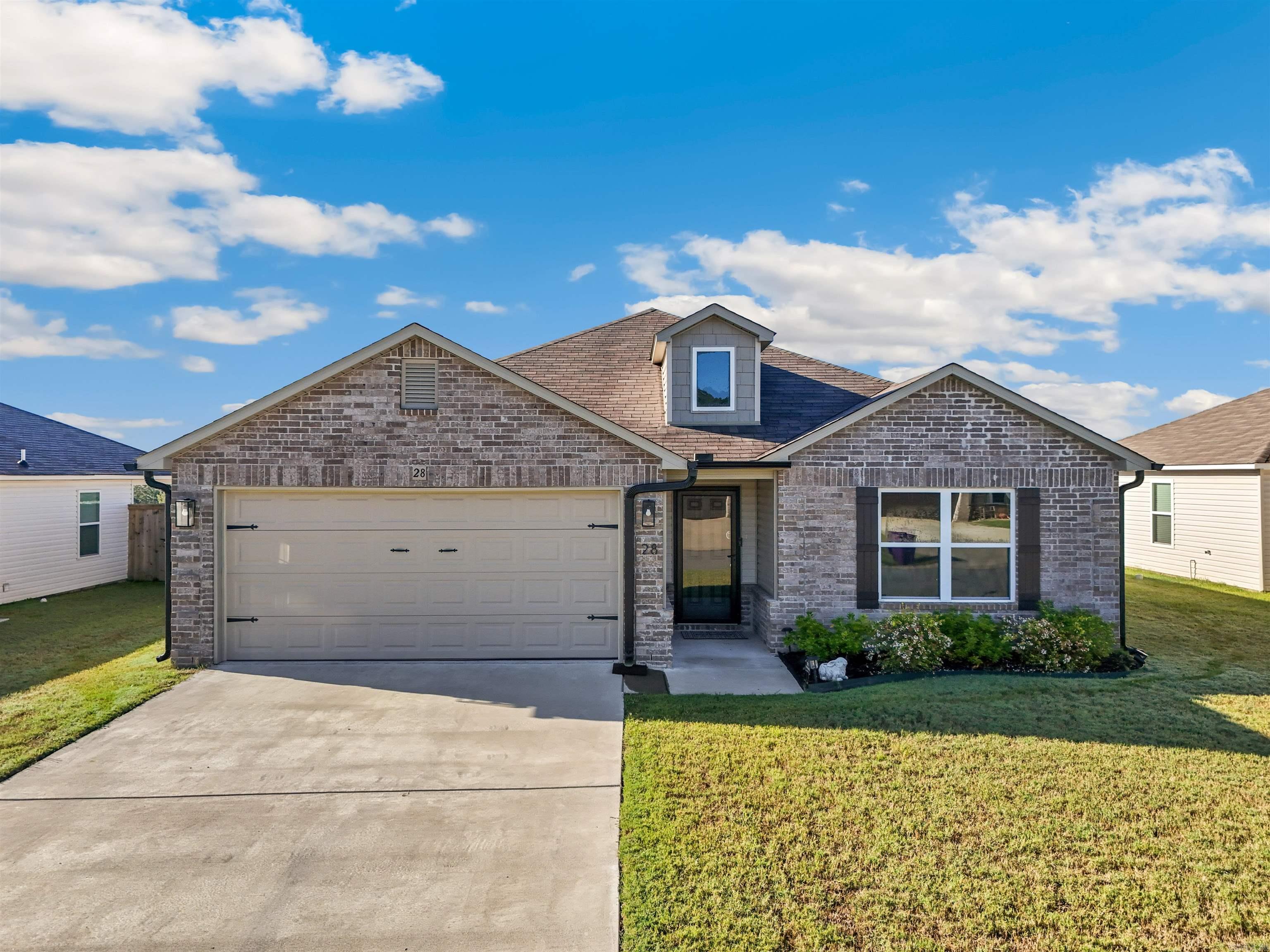 Welcome to your dream home! This beautiful newly built residence, completed in 2023, offers modern living with an array of upgrades and features. Located just outside Conway city limits in a quiet and safe neighborhood, this property is ideal for families and pet owners. A premium Anderson door enhances both security and aesthetic appeal. Be greeted by a beautiful entryway that sets the tone for the elegance found throughout the home. Enjoy a sense of space and openness with 9ft. ceilings throughout. The home is adorned with high-quality paint for a polished and durable finish. Stylish and functional kitchen cabinets provide ample storage, and the stainless-steel appliances add a sleek and modern feel. Durable and attractive luxury vinyl plank flooring throughout and an added touch of softness with carpet in the bedrooms. Unwind in the evenings with stunning views that provide a serene backdrop for relaxation. The large, fully fenced backyard is perfect for outdoor activities, gardening, or entertaining guests. Professionally installed seamless gutters ensure efficient water drainage and peace of mine. Don't miss out seeing this one! Check out the 3D tours and drone footage.