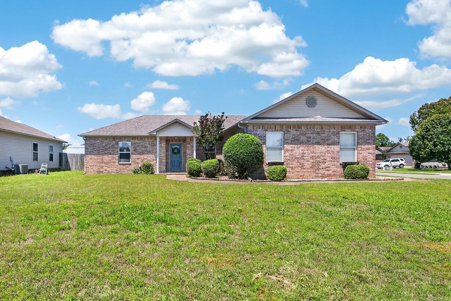 Discover this move in ready home in Orchard Hollow Estates! This beautifully maintained 4 bedroom, 2 bathroom home is ideally located in a great neighborhood close to schools, shopping, and everyday conveniences. Step inside to a spacious living room featuring beautiful tile flooring that flows throughout the main living areas and bathrooms, with carpet only in the bedrooms for added comfort. The split floor plan offers both functionality and privacy, with the spacious primary suite tucked away on one side of the home featuring a double sink vanity, large walk in closet, and shower/tub combo. Three additional bedrooms are thoughtfully positioned on the opposite side of the home. The kitchen is perfect for cooking and entertaining, complete with a breakfast bar, stainless steel appliances, beautiful cabinetry, and ample storage space. Step outside to enjoy the spacious back porch overlooking the fully fenced backyard, all situated on a large corner lot. Additional updates include a NEW roof installed in 2023. This well kept home truly checks all the boxes don’t miss your opportunity to see it!