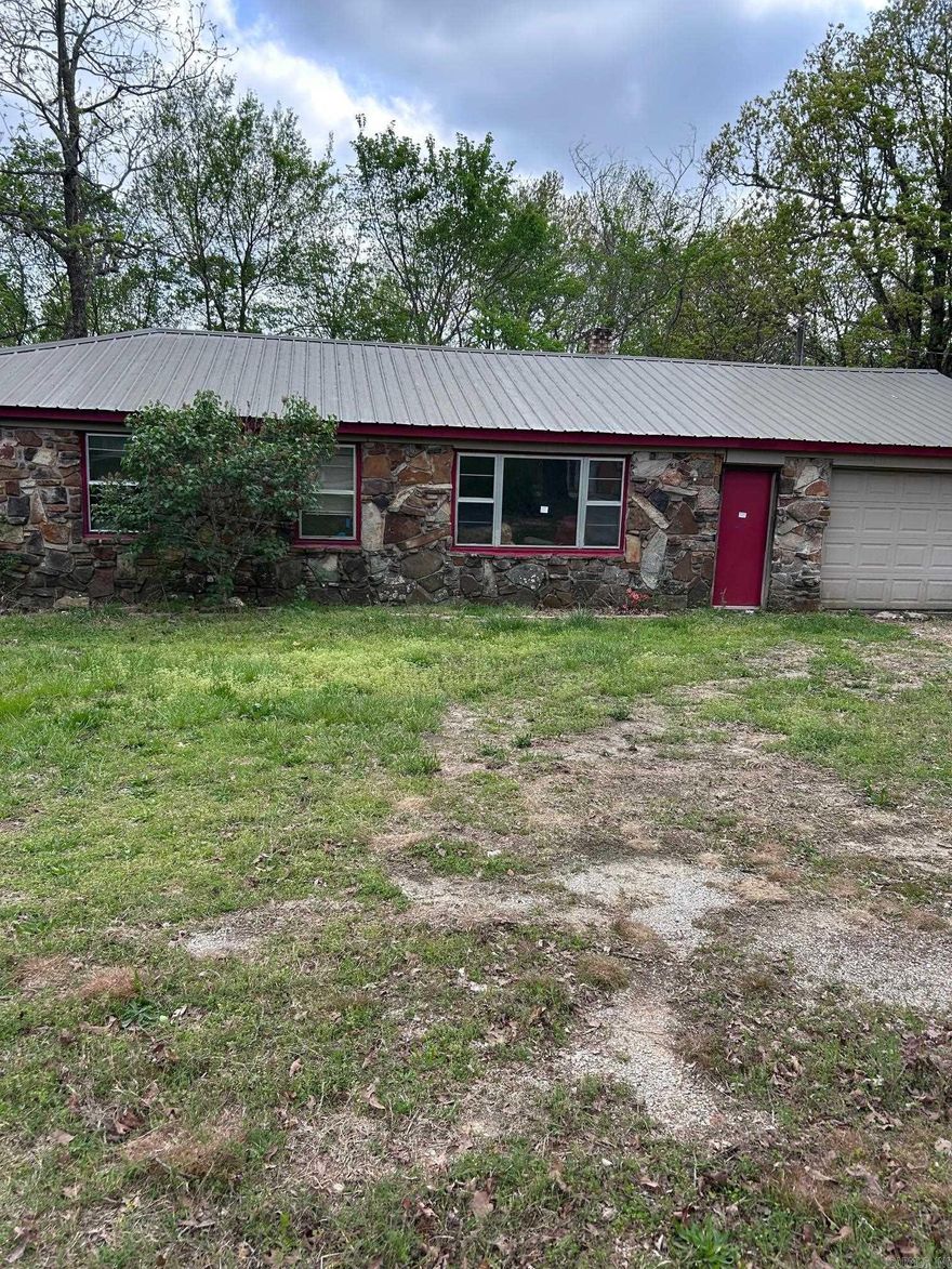 Nestled in the peaceful surroundings of Marshall, AR—just a short drive from the scenic Buffalo River—this 3-bedroom, 1-bath brick home offers endless potential. Whether you're looking for a summer retreat, investment opportunity, or full-time residence, this property is a great fixer-upper with solid bones and plenty of charm. Enjoy the serenity of nature with frequent wildlife sightings and relax on the spacious side deck, perfect for morning coffee or evening gatherings. With its tranquil location and attractive price, this home is priced to sell and won’t last long. Don’t miss your chance to own a slice of the Ozarks!