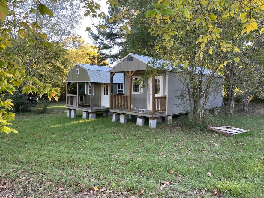 Investors!  Two unfinished 12'x26' buildings on two lots with city sewer, water, and electric.  Finish these to make great rental units.  2.2 miles to public boat launch at Dripping Springs on the Little Red River.  All items in the units will convey to buyer including new portable A/C units, refrigerator, stove, and new bed frame.