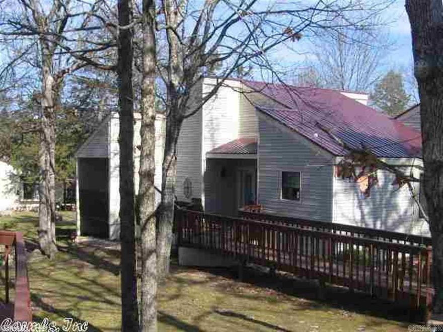 This has everything on your checklist!  ONE-level, spacious condo is an end unit.   Expanded rear deck overlooks a peaceful wooded area, & stone walkway to front.  Tasteful interior colors,  wood & Carpet flooring, energy efficient windows & exterior doors.  2 large BR, 2 full Baths.  All appliances are included, and some newer, basic furniture.  Permanent entry cover.  Wooden plantation & pleated blinds offer lots of natural light or adjust for privacy.  Nice appliances, paint, hardware, plate/plug covers, faucets, pulls, etc.  Complex has a metal roof (2013). Carefree & classy living. One of the best units!  Don't miss this one!