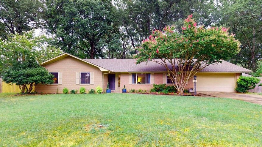 Step into this timeless 4 bed/2.5 bath mid century modern style home nestled on a 1/2 acre lot in West Gate Subdivision. As you enter the home, you will find a spacious living/dining area w/ Parque wood floors, a neutral color scheme & large picture window overlooking a beautiful front yard. Walk through the to the next area & you'll find a cozy family room w/ wood burning fireplace that overlooks the large tree covered backyard. This room is open to an updated kitchen that shows off the beauty of a true MCM house. Granite counters w/ breakfast bar, tile backsplash, & stainless steel appliances. You will also find an additional seating area perfect for a breakfast nook. Don't miss the half bath & enormous laundry room off of the kitchen that offers the perfect space for a home office, craft room, etc. All four bedrooms are together on the other side of house. Primary suite offers a large walk in closet, adjoining bathroom w/ walk in shower & large cozy bedroom. All bedrooms have good closet space! Full bathroom can also be found on same side as other three bedrooms. 2 car garage, fully fenced 1/2 acre lot with custom treehouse! 2 refrigerators & washer/dryer will convey.