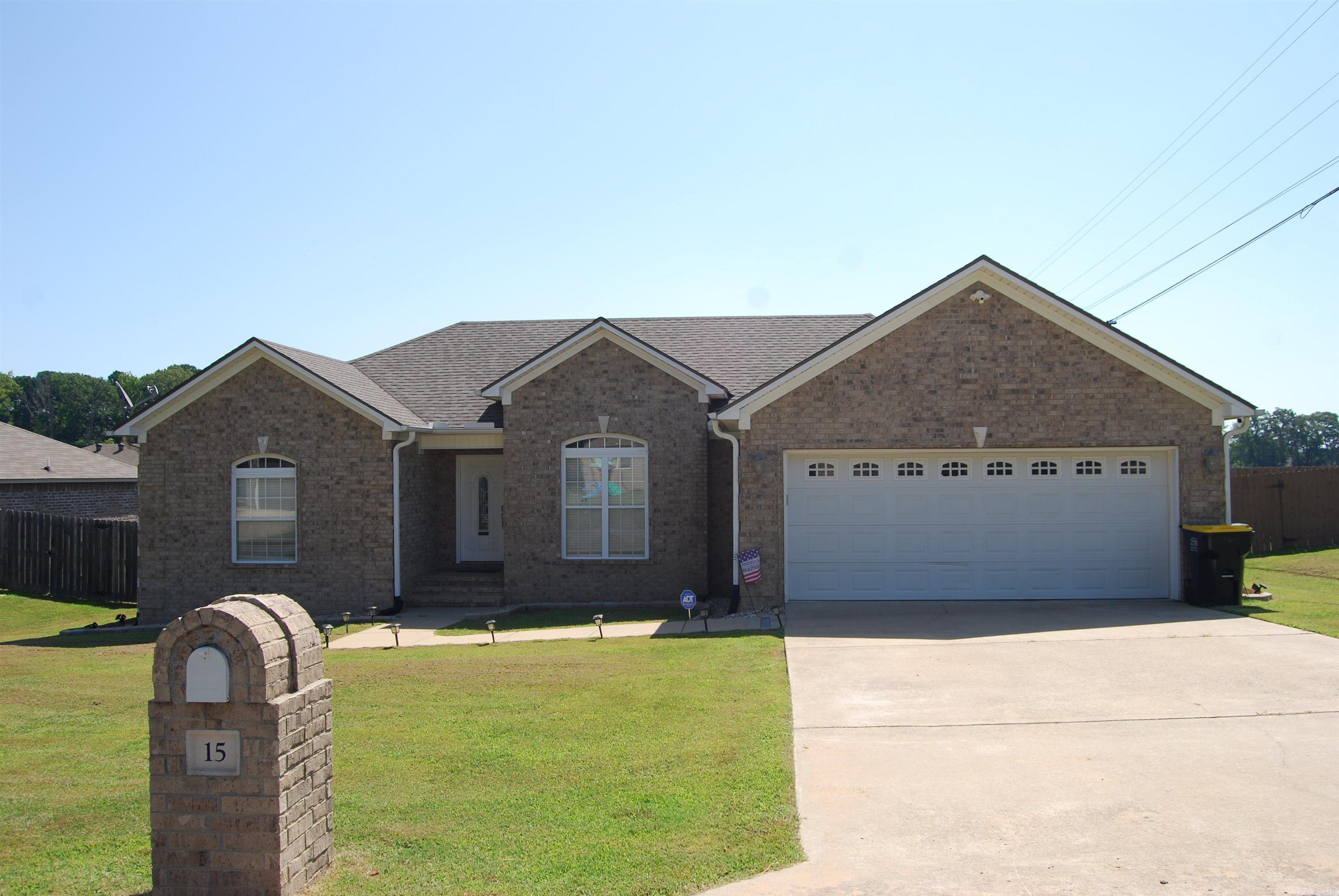 Better than new! This beautiful 3-bedroom, 2-bath home with a 2-car garage sits on a spacious corner lot and truly checks all the boxes. Step inside to find granite countertops, luxury vinyl flooring, a mix of tile and carpet, and a well-designed split floor plan. The great room offers a warm, inviting fireplace and stunning windows that overlook the large backyard. The kitchen and dining area open onto a peaceful screened-in porchāperfect for morning coffee or evening relaxation. The primary suite is a true retreat with a huge walk-in closet, dual vanities, a soaking tub, and a separate walk-in shower. Two guest bedrooms share a hall bath. Bonus features include a whole-house generator, french drains tied into the gutter system, built-in security system, and the entire home is wired for high-speed internetāideal for remote work, streaming, and smart home upgrades. This home blends comfort, security, and modern convenienceāmove-in ready and made for living!