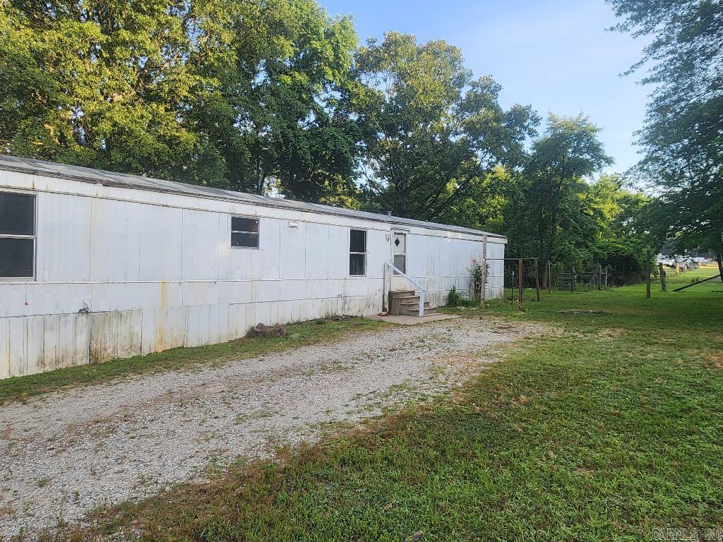 Mobile home park on approx. 4 acres for sale at 224 Melody Ln., Judsonia AR. 4 current mobile homes in operation. 3 lots hold derelict homes and 1 lot is empty in addition to active homes; all 4 of these unused lots have electricity (service poles), septic, and water installed and would be perfect to convert to RV and/or Tiny Homes multiplying their utility as this is a nice piece of land with lots of potential. 224, 229, 228, and 231 are the active homes.