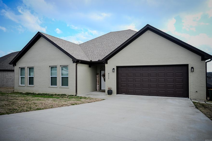IMAGINE FAMILY COOK OUTS ON THIS ELEVATED COVERED PATIO!! Like-new 2023 construction with modern style and space to entertain! This beautiful 4-bedroom, 3-bath home offers approximately 2,300 sq. ft. of thoughtfully designed living space in the desirable Sherwood area. The open-concept layout features luxury vinyl plank flooring, a large kitchen island, stainless steel appliances, and an inviting living room with an electric fireplace. The split-bedroom floor plan provides privacy, while the spacious primary suite offers a relaxing retreat with a large bathroom including a soaker tub, separate toilet room, walk-in shower, and walk-in closet. Enjoy outdoor living on the covered patio with a generous backyard, and outdoor ceiling fan. Conveniently located near shopping, dining, and major highways.