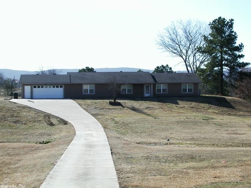 Great family home in Lake Hamilton School District on 5.35 acres. Half cleared and half wooded.  In-ground pool, attached garage plus a detached shop and carport. Big family room, game room, plus a sun room Beautiful mountain views from the back patio.