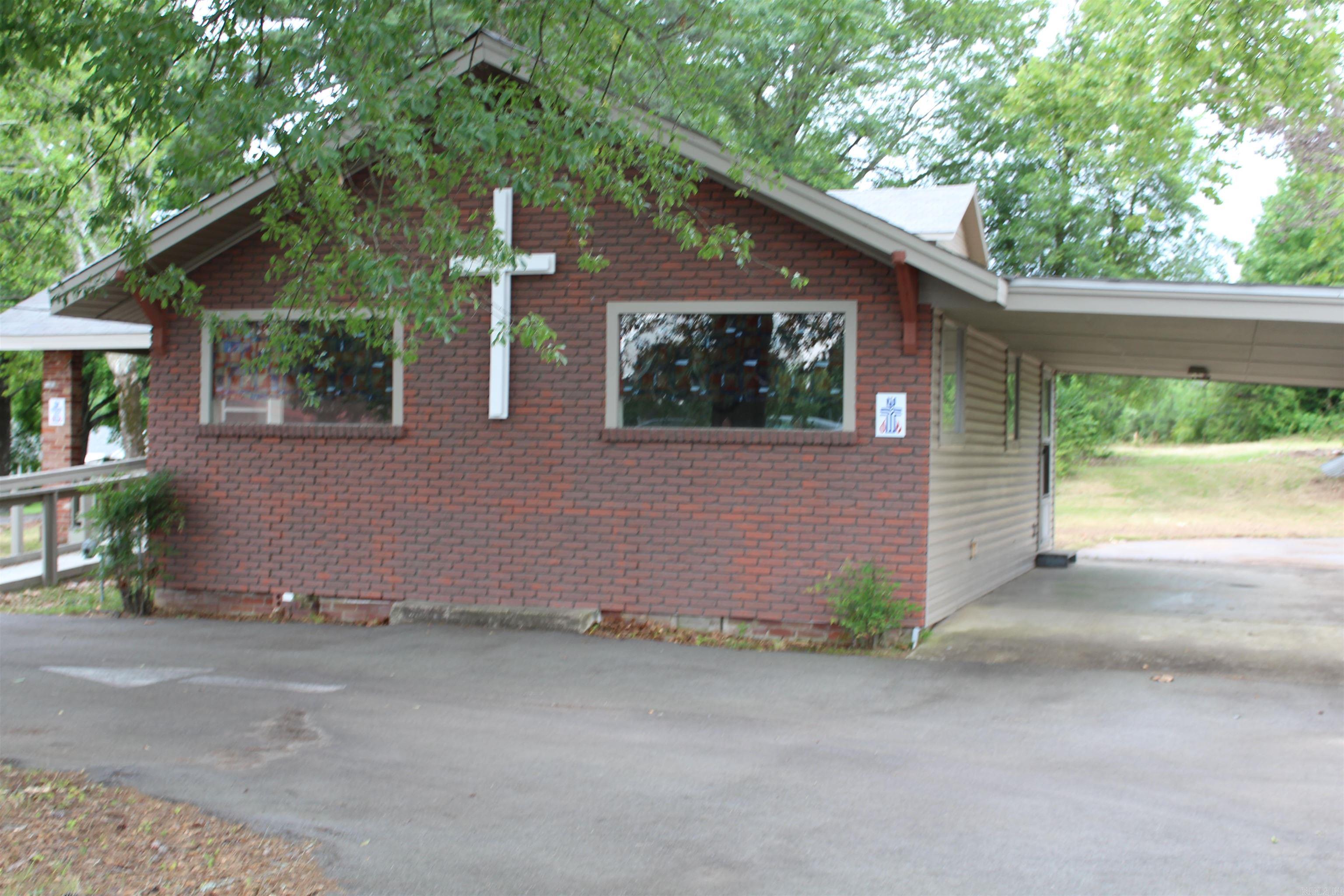 Commercial Building used as a church *** can be a daycare or any type of business *** 5 acres *** Parking space for approximately 30 cars *** 5 acres runs deep *** Maintenance Free ***