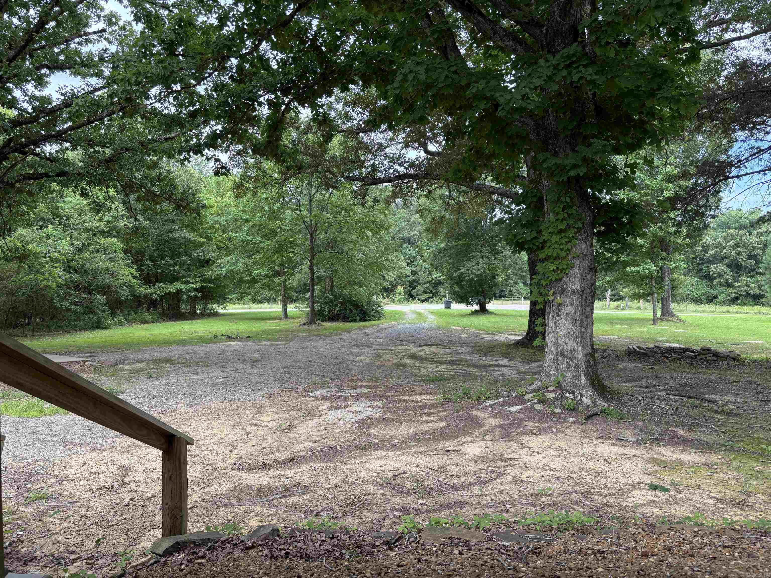 27+- wooded acres with dozens of build sites if another home is needed. 2 Bed @ full bath 1350 square foot metal home with concrete floors. Large Bathrooms, large closets, One care garage all built on a slab. Level land with a view of the Little Red River drainage from the back side of property. The owner has buitl several well maintained trails though the proeprty with food plots and shooting lanes. Good Deer and Turkey are frequently seen on the property. Very close to town, quiet, and secluded. Well built home with a barn used for storage and a metal storage shed with concrete flooring. City Water brand new septic system, RV hook up, parking for dozens of vehicles. Big tree Shaded yard. Outstanding property to call home.