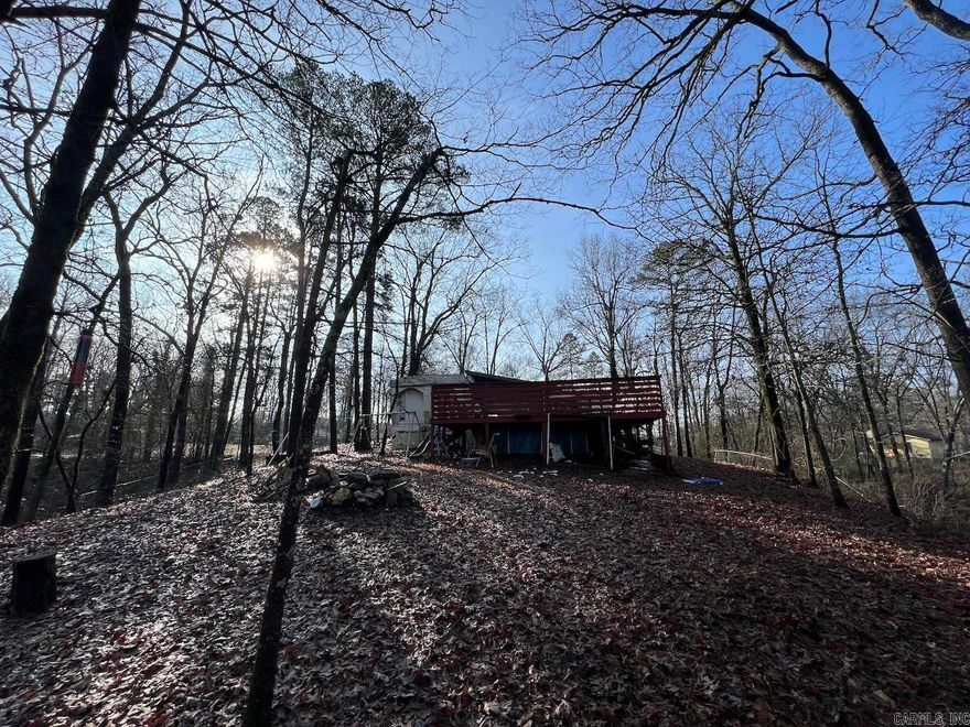 2 FIXER UPPER MOBILE HOMES, NICE BACKYARD VIEW!  Sold AS IS you can move out the trailers and put a new one or build your dream home.  Possible owner financing, see agent remarks.