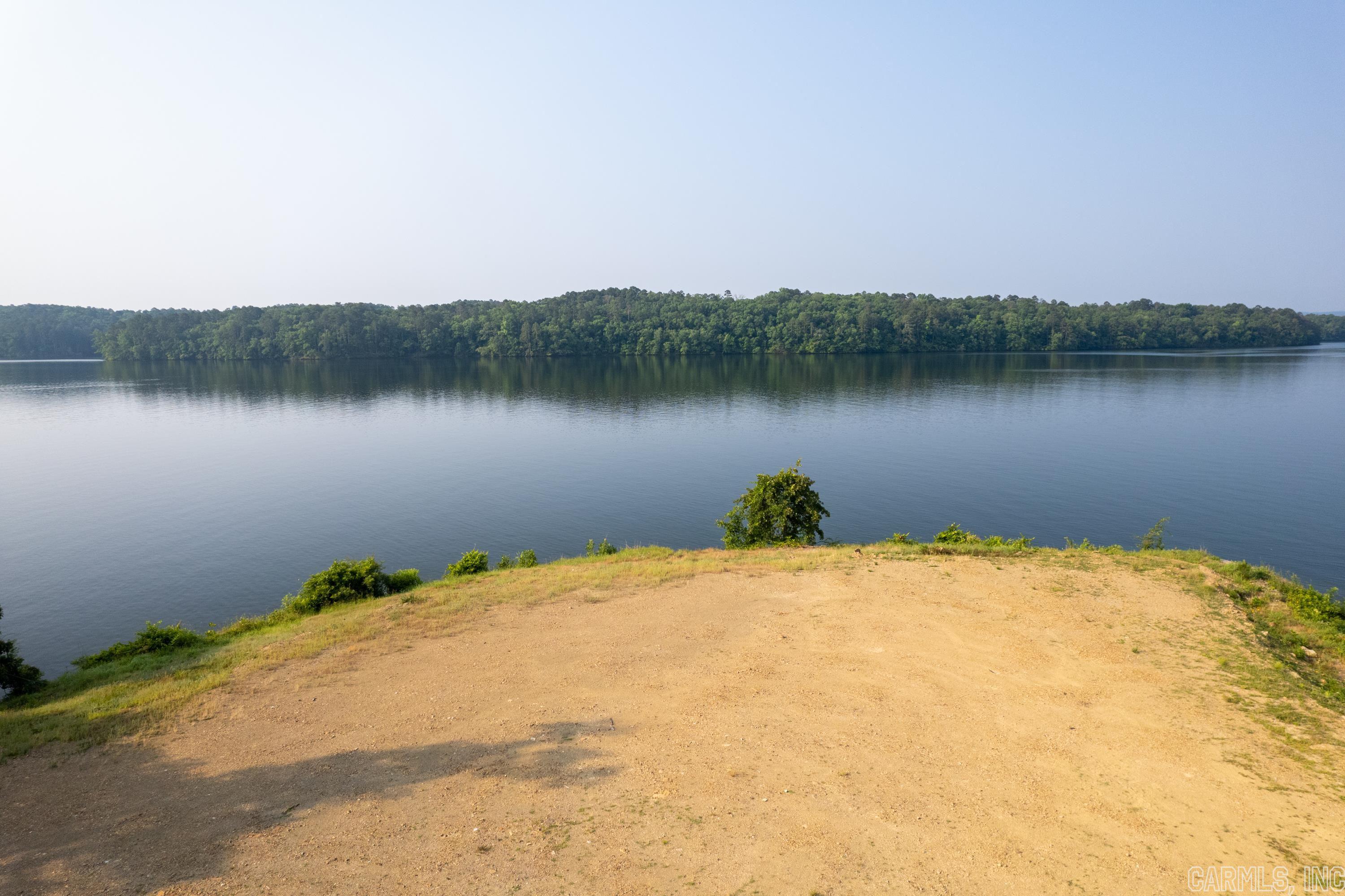 The most premier lot on Lake Hamilton is now available to purchase. 623 Peninsula features 1.43 acres, 492' of lake frontage, and thebest views on the lake. The lot is already cleared and ready to start construction of your dream home. What makes this property sounique and coveted is the location of the property, the panoramic views of the lake, beautiful sunsets, and protected views of GarvanWoodland Gardens across the lake channel. Lot also features a swimming/beach area with stairs.