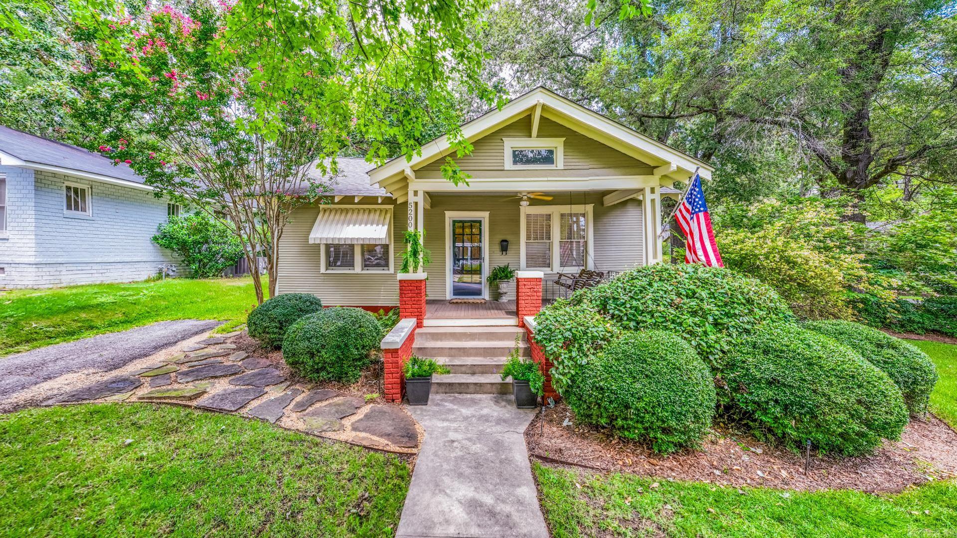 Classic Hillcrest Craftsman on a storybook corner lot! This 2-bedroom, 1-bath home is filled with character, from the inviting front porch and original hardwood floors to the formal dining room and updated kitchen. Enjoy your private backyard oasis with lush landscaping, irrigation in the front and back, and a spacious shed perfect for hobbies or storage. Multiple parking options in both the front and rear make entertaining easy, just picture fall evenings around the fire pit with friends. Recent updates include all new electrical, HVAC, exterior paint, and siding repairs. Move-in ready and perfectly situated in one of Little Rockās most beloved neighborhoods! Agents see documents for survey, measurement and more information.