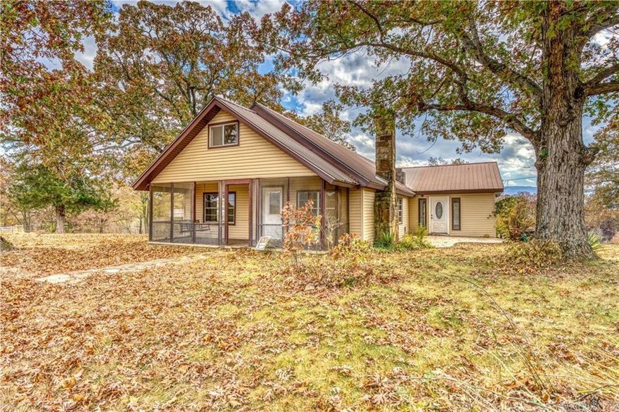 Look no further if you are searching for a home that is in a private, rural location with very few neighbors, close to the Buffalo River, sits on an acre of land, but still has all the modern day amenities like wifi! This 2,978 sqft home features 3 bedrooms (with the potential to have 4 total) and 2 full bathrooms plus a half bath. The home is a blank canvas ready for your finishing touches. There is an unfinished basement garage/workshop space, 1 fireplace, 2 tankless hot water heaters, the land is nice and level to gentle sloping, has a 2 car covered carport, multiple screened in decks/porches and plenty of space for a garden and animals. Whether you make this your next family home, a vacation home or a nightly rental, this property is one of a kind and a real gem to find! There are up to 2 additional acres available for purchase for additional cost for a total of 3 +/- acres.