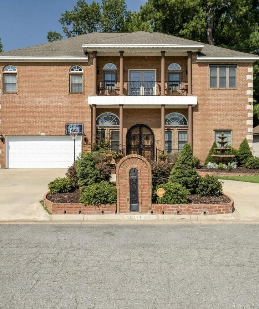 This contemporary style home is a luxurious masterpiece! A charming fountain compliments the front garden creating a tranquil oasis. Arched-French doors open to a large foyer with marble floors, high ceilings with crown molding, and a winding staircase in the center. The living room opens to a large kitchen with a breakfast bar, stainless steel appliances, a wine chiller, and a dine-in area. A spacious laundry room with a half bath, a formal dining room, a BONUS/GUEST/GAME room, and a full bath make the lower level a perfect place to entertain. The winding stairs lead to a huge loft with balcony access, providing the perfect place to watch the sunrise. The primary suite lies on one side of the loft with a gas fire place, two walk-in closets and a full bath with double sinks, a stand up shower, and a whirlpool tub. There are two more bedrooms and a full bath on the opposite side of the loft. This home is the perfect blend of classic design and modern luxury! NEW HVAC, new garage door, and some new appliances; conveniently located less than 8 mins. to the Outlets of Little Rock and less than 10 miles to Downtown Little Rock.