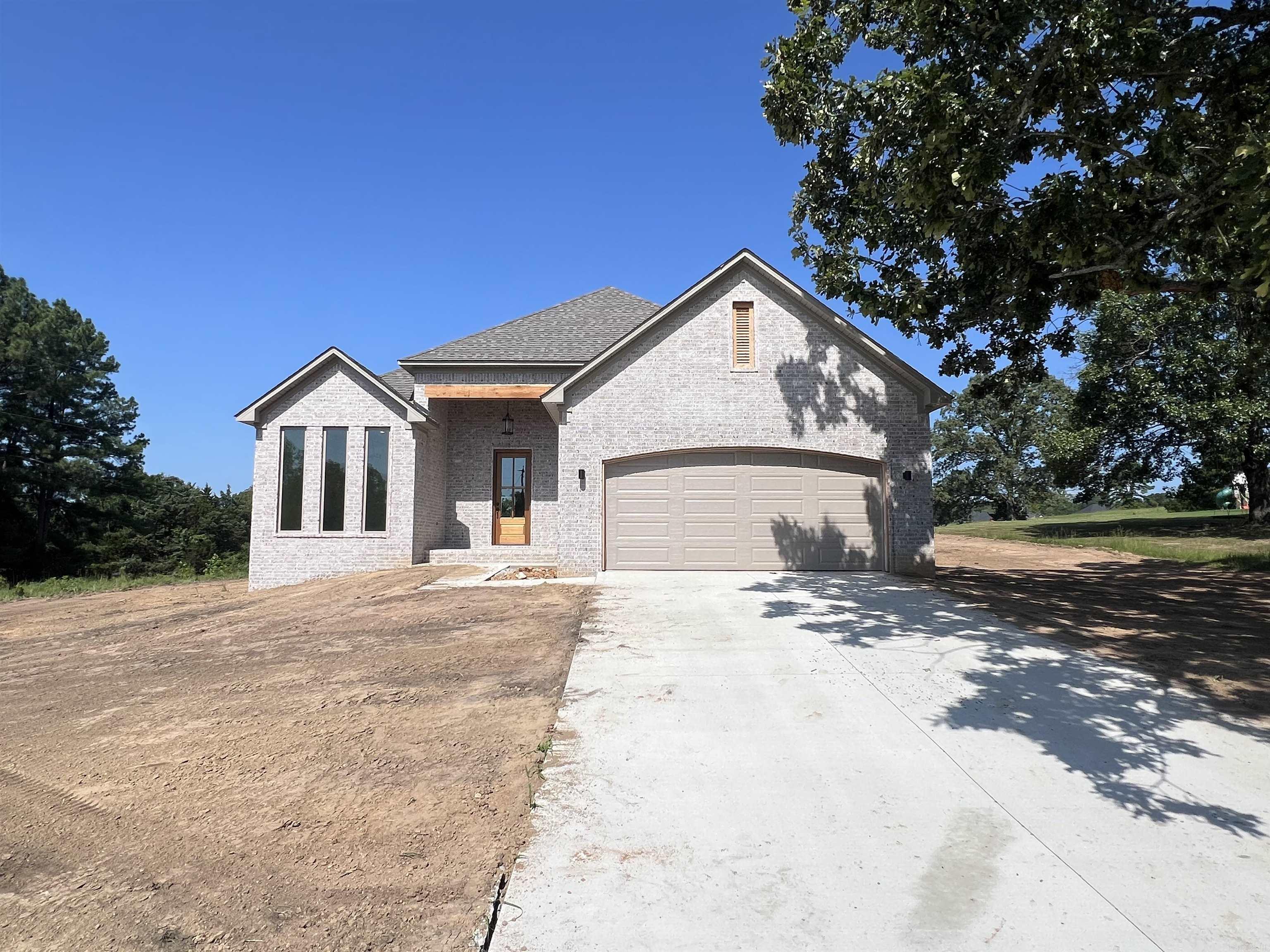 Come home to this stunning new construction in the heart of Greenbrier! This custom-built beauty features an open-concept living area with a vaulted ceiling, granite countertops throughout (even in the laundry room with a folding table!), industrial-strength LPV flooring, and charming front and back outdoor spaces with a porch and patio. The master suite boasts a spacious closet and a luxurious tiled walk-in shower, while elegant moldings accent the living room and master bedroom. Thoughtfully designed for both style and function, this home is ready to become your sanctuary. Taxes estimated based on the lot.