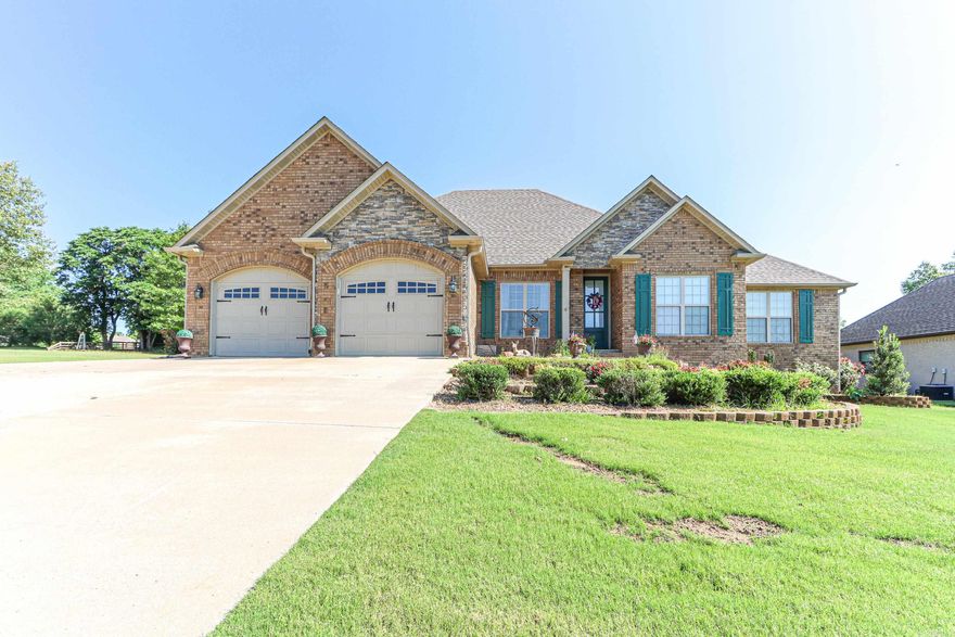This well cared for all brick home has two lots and a shop, a newly added sunporch with a solid foundation/roof and over 500sf. screened in. and sprinkler system for all the beautiful landscaping. The primary suite has an updated bathroom with a large tiled walk in shower and bench accented with glass doors, and two separate vanities, land walk in closet, the laundry room has storage and shelving was added all granite counters in the Island kitchen, sliding shelves in all lower cabinets, formal dining and eat in breakfast area, three well appointed guest rooms are on the opposite side of the home from the primary suite, sharing a full hall bathroom. Detached shop workshop