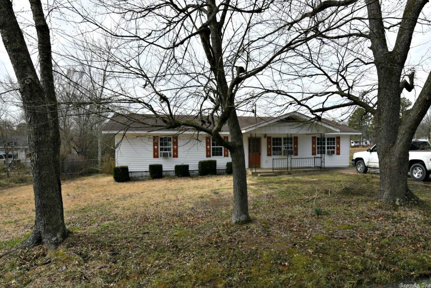 Nestled in a quiet neighborhood on the outskirts of Mena, AR, this characteristic house is just waiting to welcome a new home buyer, or to be flipped into a rental investment opportunity. With four bedrooms, and one bathroom, there is plenty of space for a family. The building has central heating and air, but also comes with several window units to help keep the place cool in the summer. Out front there is a parking slab, as well as a small outbuilding complete with a basketball goal. In the partially fenced backyard, there is a small, attached deck and another compact concrete slab which has been used for parking a project car. Looking to buy a place that's good for raising a family? Or looking to make a profit from renting something out? This place might just be for you.