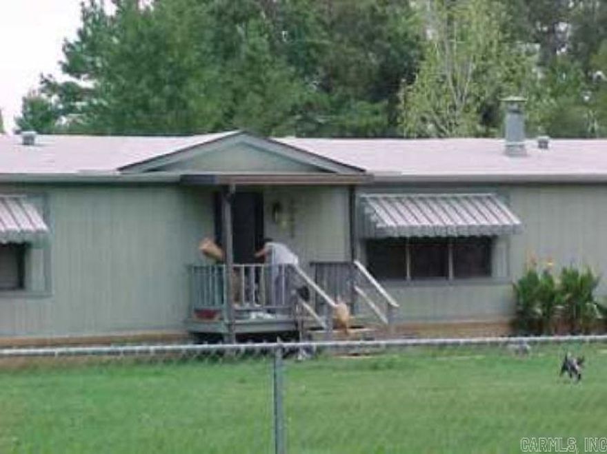 Great opportunity for an investor or a fixer upper just 15 minutes South of Little Rock. Located in the Maple Creek/ East End Community and the Sheridan School District. 1.7 acres right off the I-530 Woodson Rd exit. Mobile Homes needs remodeling. Comes with a 2 car carport attached to home. Call me for a viewing