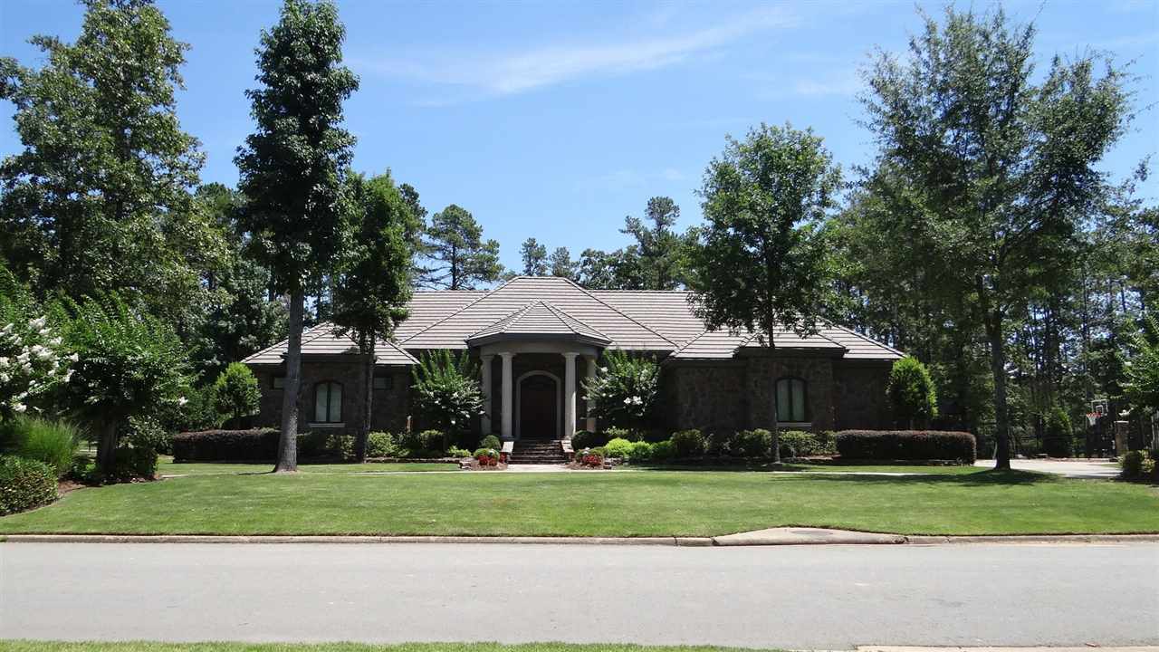 Stunning all natural stone clad house situated on Bear Den Golf Course hole #3.  Circle drive in a quiet gated neighborhood in Chenal.  Precast accents and concrete tile roof along with custom metal trim.  5 bedrooms, 4 baths, large den with stone fireplace open to the kitchen. Huge laundry room and office with built ins. Large bonus room upstairs.  Natural stone covered patio and gorgeous swimming pool with waterfall feature. 3 car garage and 1 golf cart bay.