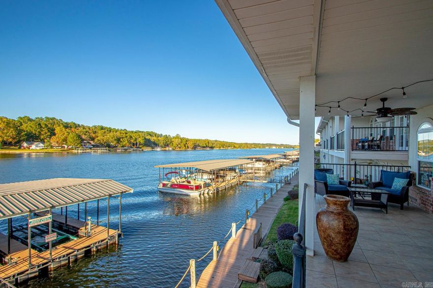 4 bedroom, 4 bath condo on Lake Hamilton in a gated neighborhood. It is off Central, minutes to Oaklawn. It has an open floor plan with two bedrooms downstairs and two large bedrooms upstairs with a balcony looking over the water. It features 9 ft ceilings, a fireplace, granite, and a large private covered deck with a one car garage. Call to see it today!