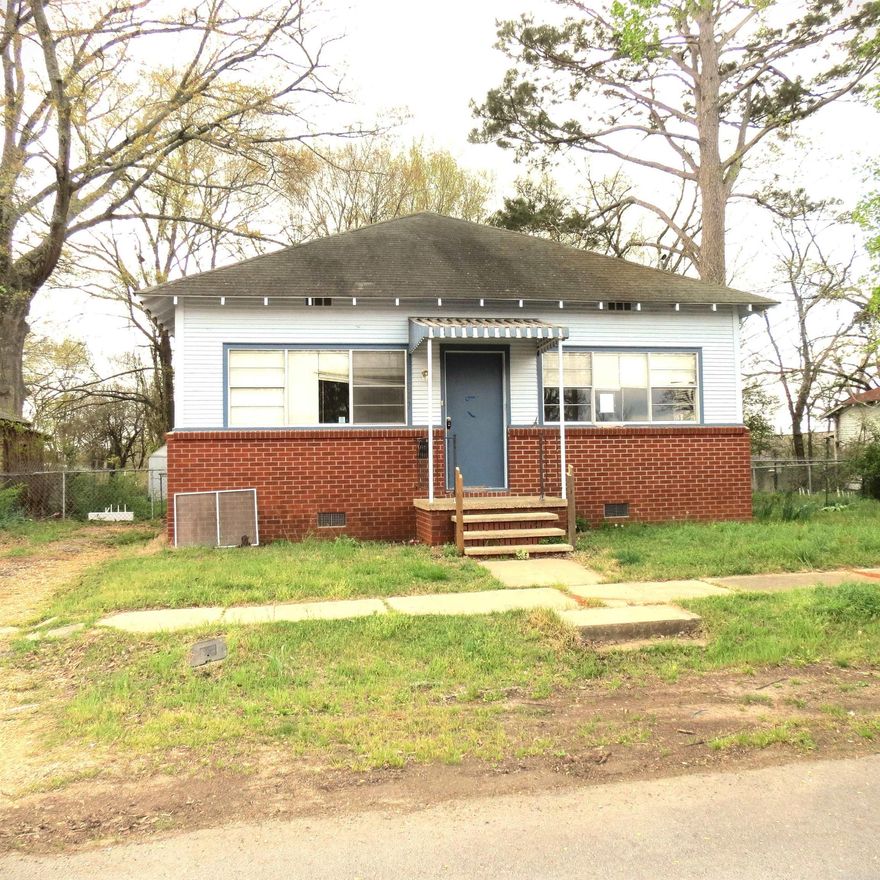 Cute home in Sheridan.  Large living room, tall ceilings, extra room that could be used for many purposes.  Storage building.  Year built on this home is unknown.  **Agents See Remarks**