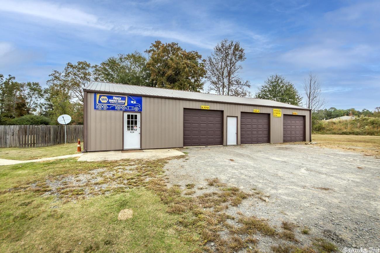 Great investment opportunity! This 30x60 three bay shop with office space will fit your business needs. This shop has central heat and air, a restroom, breakroom, and a lobby area. The third bay of the shop has a drain system in place. Included with the shop is a 3bedroom 1bath home. The home has a new water heater, new dishwasher, metal roof, an additional 16x30 shop, storm shelter, and a barn within the fenced back yard. All if this sits on 2.43 acres and is zoned C-2.