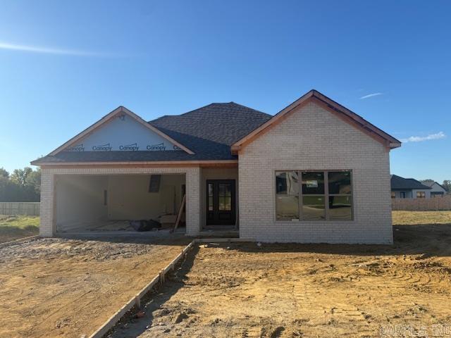Large living room open to the kitchen. Pantry in the kitchen. Nice sized island in the kitchen with cabinetry in the island. Electric fireplace. Lots of windows make the home bright and airy. Guest rooms are separate from the primary bedroom. Tile showers in bathrooms.