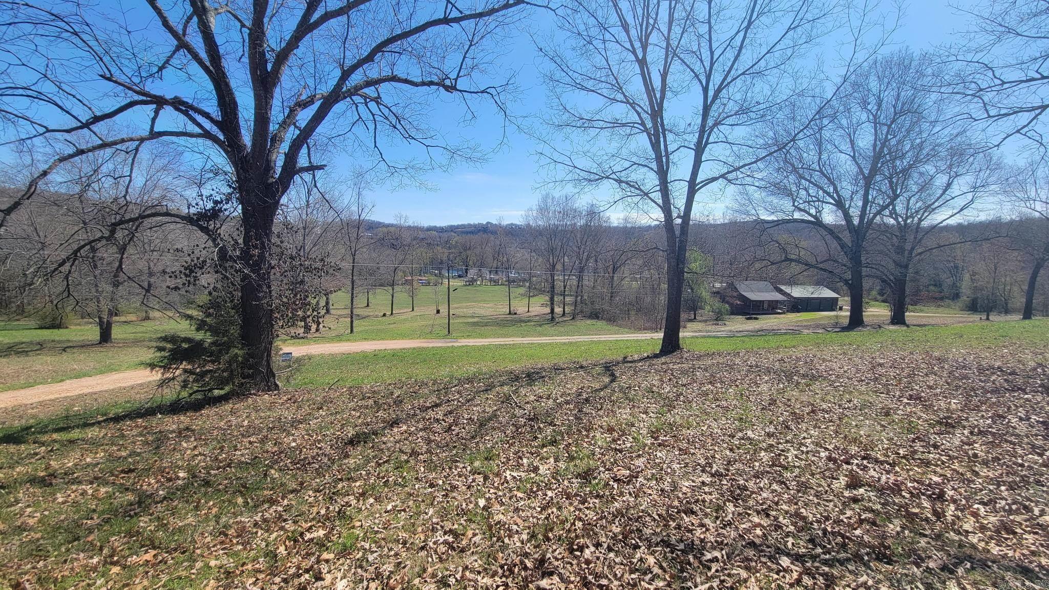 Prime 1.24-Acre Lot in Cotter, Arkansas – Trout Capital of America! Discover the perfect blend of natural beauty and investment potential with this 1.24-acre cleared corner lot in the heart of Cotter, Arkansas — proudly known as the Trout Capital of America. Offering sweeping seasonal views of the iconic White River, this property is just two minutes from the White River, public boat launch, and the charming Cotter Spring Park, making it an ideal location for outdoor enthusiasts. With electric already available, mature trees adding character, and vacation rentals allowed, this lot is ready for your dream home, cabin getaway, or income-producing property. Whether you’re looking to build a private retreat or a vacation rental hotspot, this rare opportunity puts you right where the action is — fishing, floating, hiking, and more, all just steps away. Don’t miss your chance to own a piece of Cotter paradise — where small-town charm meets world-class outdoor recreation.