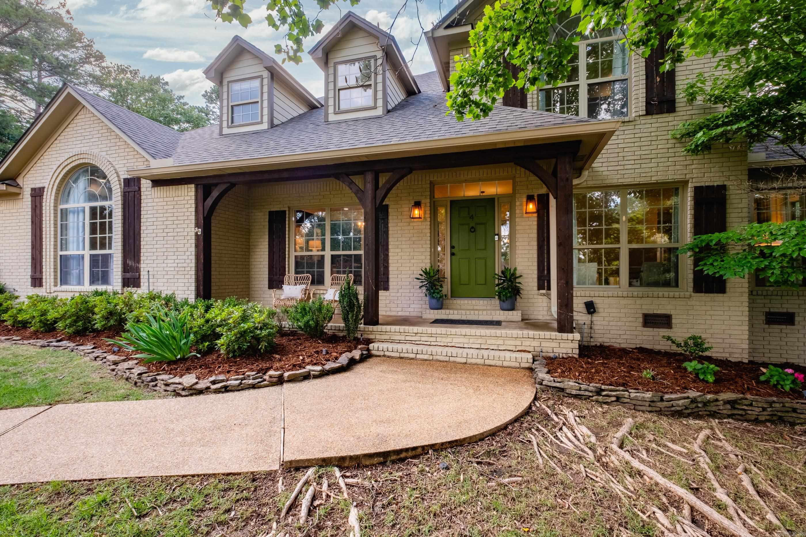 Nestled in the heart of Chenal's coveted Bayonne neighborhood, 4 Iviers is a rare blend of Southern charm and thoughtful modern luxury. One of the original homes in the subdivision, this 4-bedroom, 3.5-bath home has been meticulously updated and sits gracefully on an oversized corner lot. Inside, natural light pours through transom windows where no detail has been overlooked. The fully remodeled kitchen is a showstopper—GE Café matte white appliances, and a spacious hidden walk-in pantry pair beautifully with a newly opened floor plan, ideal for family dinners or larger gatherings (can seat up to 24 guests between dining spaces!). Two cozy gas log fireplaces, a second living room with French door, and an inviting primary suite with a spacious sitting area offer flexible living at its best. Upstairs you will find 3 bedrooms and 2 full baths. Plenty of storage with four attic spaces, with one larger enough to finish out into a 5th bedroom or additional bonus space. Updates include extensive kitchen remodel (2023), new roof (2022), HVAC system (2024), front landscaping (2022) luxury vinyl plank flooring, custom ironwork, interior paint and light fixtures throughout!