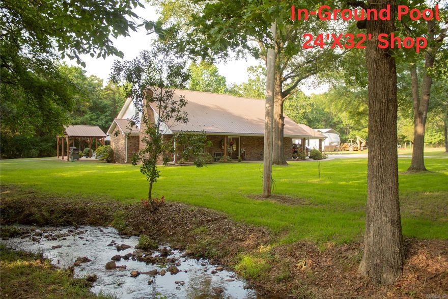 Beautiful 4 bedroom 3 bathroom brick home on 2 secluded acres with in ground Pool, Shop, Pergola and walk in Storm Shelter! Ideally located in the desirable Springhill Elementary School District, just minutes from town and only 15 minutes to I-40. This property offers the perfect blend of peaceful country living with a porch on the front and back of the home and plenty of mature shade trees around the property. Built in 1995 with recent updates such as: new LVP flooring throughout, new carpet in the downstairs primary bedroom and downstairs office/guest room and new epoxy countertops. Refrigerator, Washer and Dryer are 1.5 years old and all convey with the property. Whether you're looking for space to entertain, working on hobbies in the shop, or relaxing by the pool, this home has it all. Schedule your showing today and discover the best of country living close to town.