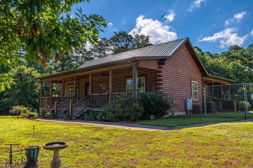 This is a hard to find authentic custom log home 6 minutes to Lake Greeson. Seller spared no expense to create a cozy atmosphere with plenty of room for a large group. Featuring bamboo flooring, whole house water filtration system and humidifier, granite countertops and sink, wet bar, outdoor kitchen, 35x65 shop, huge finished basement and several fruit trees. This property also borders Corp of Engineers land. Less than an hour to Hot Springs National Park and less than 30 minutes to Albert Pike Recreational Area. 3 acres adjoining this property could be available as well.