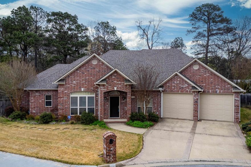All brick, one level home on a lovely cul-de-sac backing to green space. Open living area features tall ceilings, hardwood floors, gas log fireplace, and built-ins creating a comfortable gathering space. The eat-in kitchen offers a breakfast bar, pantry, and great workspace for everyday living and entertaining. Split floor plan with a lovely primary suite that includes a spacious bath and large closet. Two additional guest bedrooms share a generous hall bath. Formal dining room plus a separate office or second living area provide flexible space for work or entertaining. Step outside to an awesome vaulted covered patio overlooking the beautifully landscaped backyard with water feature and full fencing for privacy. Come see!