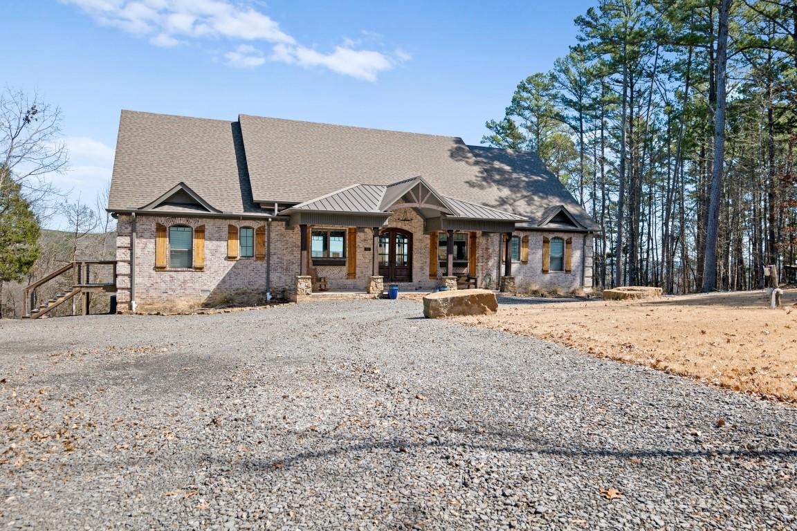 Welcome to On the Rocks a custom lake home with panoramic views of beautiful Greers Ferry Lake. Live, work or play from this elegant retreat with an inviting interior, featuring 3 bedrooms, 2.5 baths in Edgemont, AR. You will fall in love with this cozy fireplaces, vaulted ceilings and the peaceful surroundings.