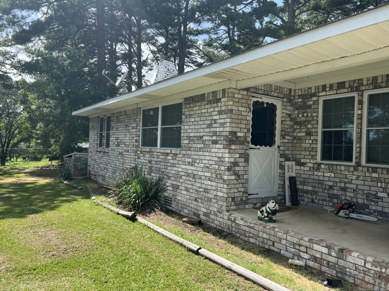 Cute 3br/1ba ready for new owners. This house is directly across the street from Lake Hamilton School! This cozy brick home has a living room with a gas fireplace and nice breakfast area off the kitchen. The bathroom has recently been updated with tile. The property has multiple large carports for parking and camper storage. There is a 30x44 -3 bay shop that is equipped with electric. Large backyard with multiple mature trees that provide lots of shade. With a little TLC, this place could be your new home!