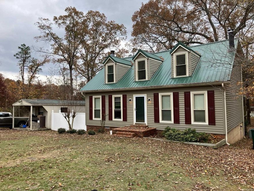 Must see! Great home in a peaceful country neighborhood! Metal roofing, vinyl siding and all windows were replaced approx 7 years back. Interior of the home has a nice feel, needs cosmetic updating but is super livable while you fix it up. Large living room w/propane fireplace and french doors leading to a large den just off of the dining area and kitchen. Pine wood flooring thru most of the home, could be refinished, or have flooring over the top of it.  Primary bedroom on the main level with beautiful wood ceiling (previous fireplace has been decommission in this room). Kitchen includes stainless appliances (all convey) and large walk-in pantry. Upstairs are two extra bedrooms, one with an extra sitting area and lots of storage space and bathroom accessible by both. Huge covered back deck. Property also includes a 12 x 28 well constructed building that is used as a shop currently but could be converted to a tiny home/air bnb, a good sized garden shed and a playhouse.  Whole home generator! Too many neat things about this property make it one to see quickly!