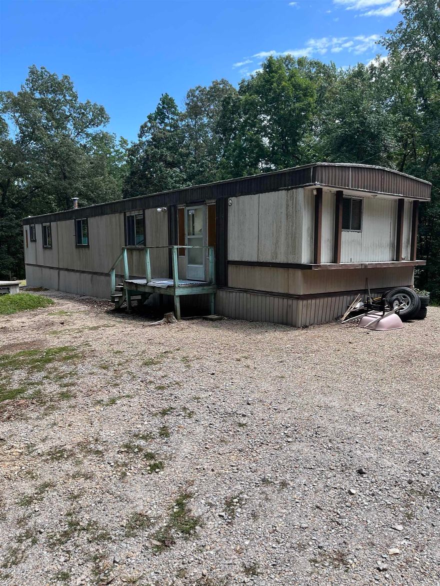 Completely remodeled Mobile Home 2.50 acres, plus 12x24 Tiny home  finished. Storm shelter.