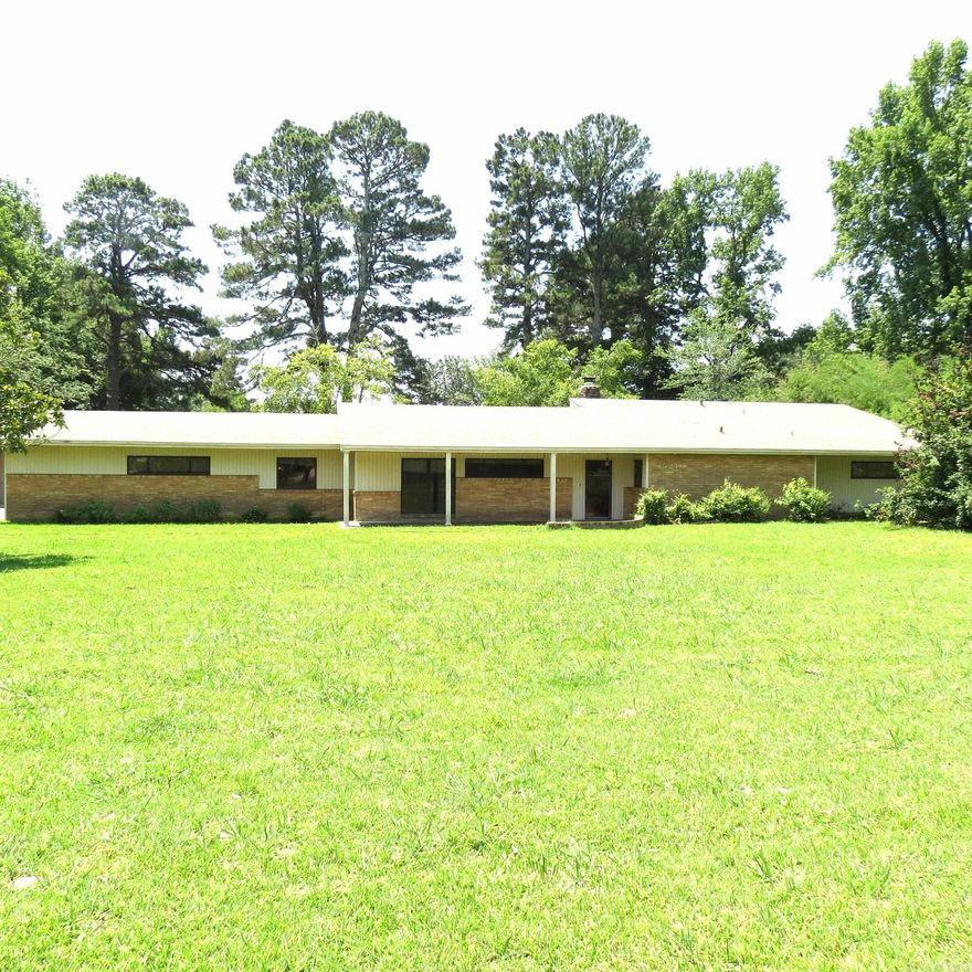 Wow what a home in town on 2+ acres with an enclosed inground pool, and 3 roll up door shop!!!  This brick & siding home has 3 bedrooms, 2 1/2 baths, living room, den with fireplace, jacuzzi off the primary bedroom.  Double garage with detached carport.  Next to large shop is a small apartment with a bathroom.  Call today to get your appointment to view the home.  Taxes are before Homestead Credit.   **Agents See Remarks**