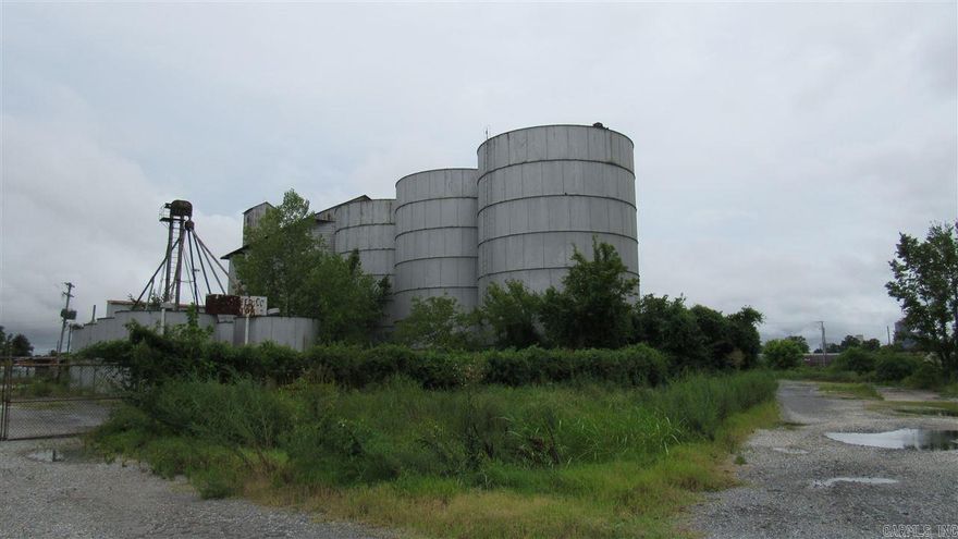 Great opportunity for large warehouse area next to rail and I-30 corridor. Huge storage tanks also included for bulk storage. Grounds are not in good condition.   Property to be sold strictly "AS IS". Buyers responsible for any utility connections for inspections. Electrical cabling  has been robbed. Possible Owner Financing.