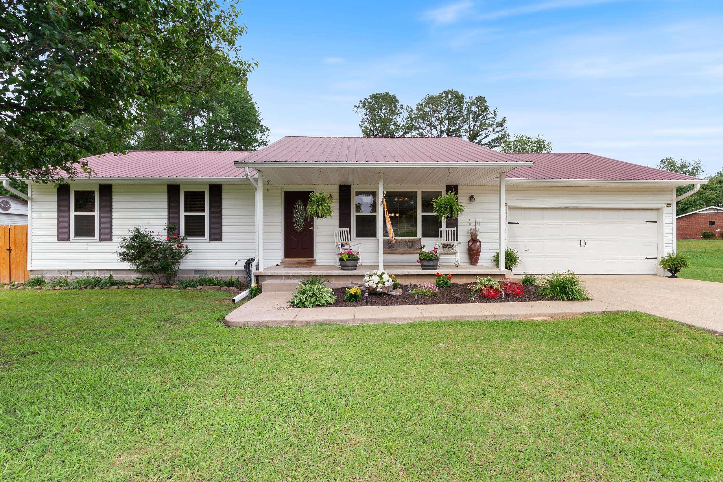 Well cared for home conveniently located! This home has 2 large living areas one is currently being used as a dining area. The large living room has beautiful vaulted ceilings with wood. There are 2 Primary bedrooms each with their own bathroom and 2 more guest bedrooms. The kitchen has nice stained cabinets and new granite countertops and newer appliances. You will appreciate the care that has been given to this home and the low maintenance exterior and metal roof. Windows in original part of the house replaced in 2023. Cedar fence will last much longer than your typical treated wood. The 18 x 20 shop is fully insulated with foam insulation. The window unit keeps you cool in the summertime as you work on your hobbies. The 27' pool is an added bonus with the decking surrounding it. There is even a 10 x 12 storage building. Yard has been well maintained. High speed fiber internet. A short walk away to the city library and tennis courts.
