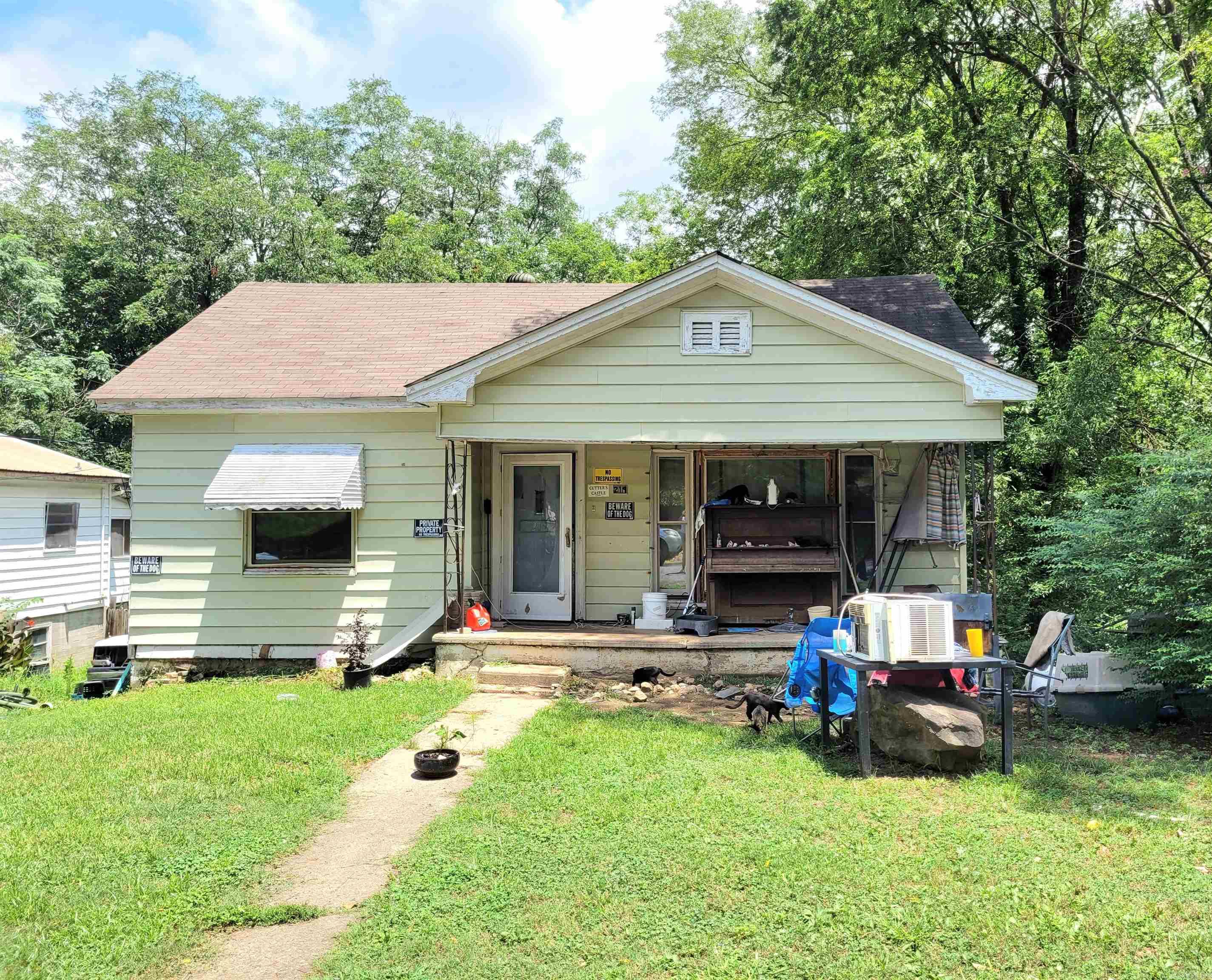 Investor Special! Attention all rehabbers and visionaries! This property is packed with potential and ready for transformation. It will require a full interior cleanout and some renovation, but it's situated in a prime location in the corridor between downtown Hot Springs, Albert Pike, and Airport Rd., offering convenient access to key parts of town. There is a partially finished 825 square foot basement as well! Zoned Commercial General (C-G), this opens doors to exciting possibilities, including the potential to apply for a short-term rental (STR) license after renovation. Whether you're looking to flip or create something truly unique, this is a rewarding project waiting to happen! Ideal for cash buyers. Sold AS-IS