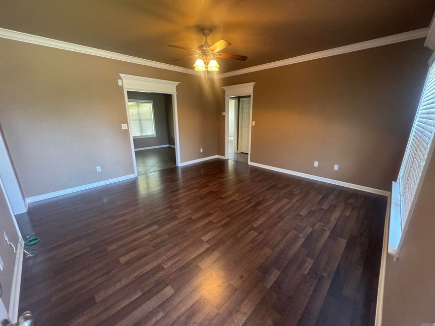 Nestled in the charming Sunset Point neighborhood, this beautiful brick-built single-story home from 2011 offers 3 bedrooms, 2 bathrooms, and approx. 1,300 sq ft of thoughtfully designed living space on a generous 9,583 sq ft lot. The layout features hardwood flooring, tray ceilings, ceiling fans, and a bright open-plan great room flowing into an eat-in kitchen with included appliances. Convenience is key with a dedicated laundry room and ample storage throughout. Step outside to discover a fully fenced backyard complete with a patio and storage building—an ideal retreat for pets or outdoor entertaining. A two-car garage adds practicality, while public utilities and modern connectivity ensure move-in readiness. With top-rated schools just minutes away and close proximity to local shopping and Harding University, this residence strikes the perfect balance of comfort and accessibility.